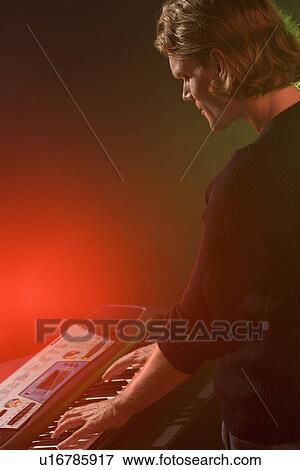 Man playing electronic keyboard View Large Photo Image Stock Photo - Man playing electronic keyboard. Fotosearch