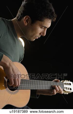 Man playing guitar View Large Photo Image Stock Photo - Man playing guitar. Fotosearch