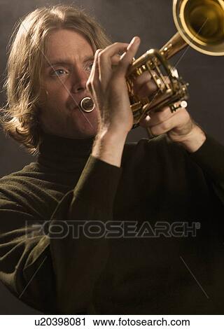 Man playing the trumpet View Large Photo Image Stock Image - Man playing the trumpet. Fotosearch