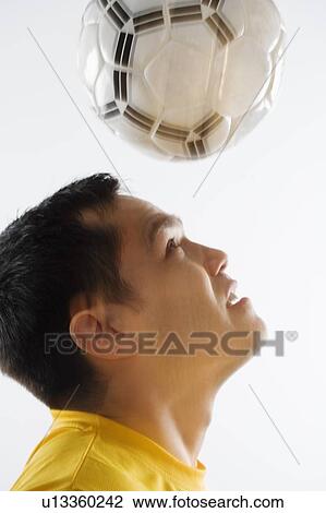 Man playing with soccer ball View Large Photo Image Stock Image - Man playing with soccer ball. Fotosearch