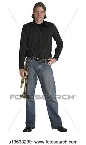 Stock Photo - Man standing with horn. Fotosearch