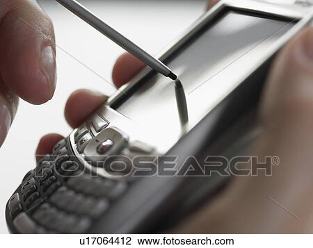 Man using PDA View Large Photo Image Stock Image - Man using PDA. Fotosearch