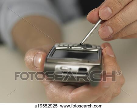 Stock Photography - Man using PDA. Fotosearch