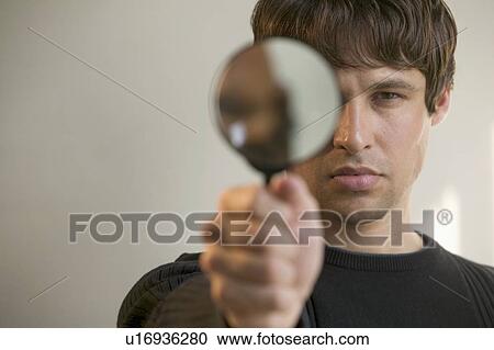 Man with magnifying glass View Large Photo Image Stock Image - Man with magnifying glass. Fotosearch
