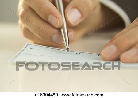 Man writing out a check View Large Photo Image Stock Image - Man writing out a check. Fotosearch