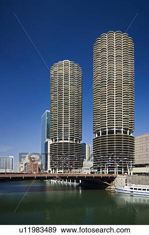 Stock Photo - Marina City Towers with boat on Chicago River Chicago Illinois USA. Fotosearch