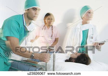 Medical staff responding to an emergency View Large Photo Image Stock Photo - Medical staff responding to an emergency. Fotosearch