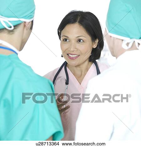 Medical team conferring View Large Photo Image Picture - Medical team conferring. Fotosearch