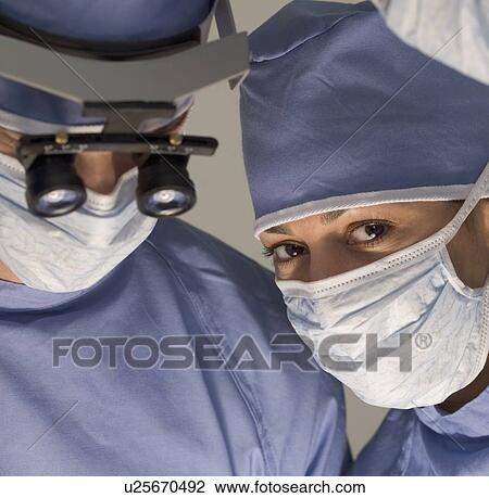 Medical team in surgery View Large Photo Image Stock Image - Medical team in surgery. Fotosearch