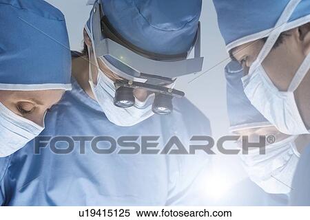 Medical team in surgery View Large Photo Image Stock Photography - Medical team in surgery. Fotosearch