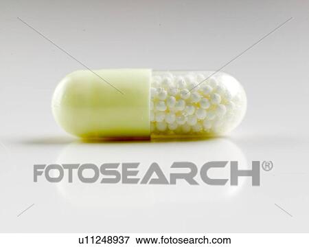 Stock Photo - Medication in a capsule. Fotosearch