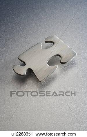 Metallic jigsaw puzzle piece View Large Photo Image Stock Image - Metallic jigsaw puzzle piece. Fotosearch