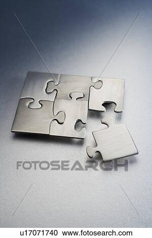 Metallic jigsaw puzzle View Large Photo Image Stock Image - Metallic jigsaw puzzle. Fotosearch
