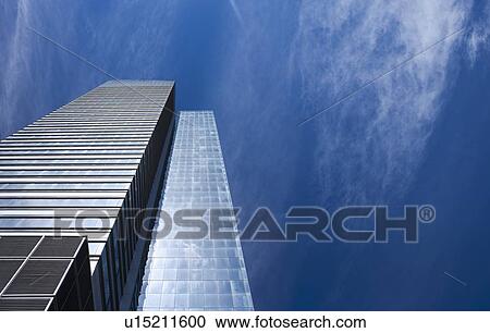 Stock Image - Modern office building and blue sky. Fotosearch