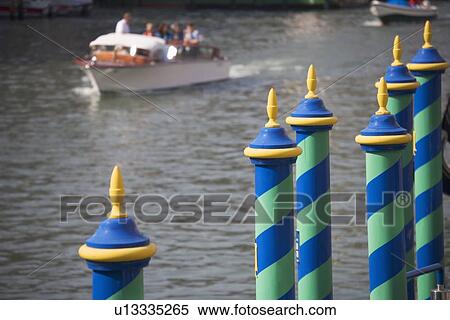 Mooring poles along the Grand Canal Venice Italy View Large Photo Image Stock Photography - Mooring poles along the Grand Canal Venice Italy. Fotosearch