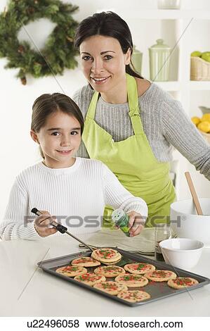 Mother and daughter baking Christmas cookies View Large Photo Image Stock Photo - Mother and daughter baking Christmas cookies. Fotosearch