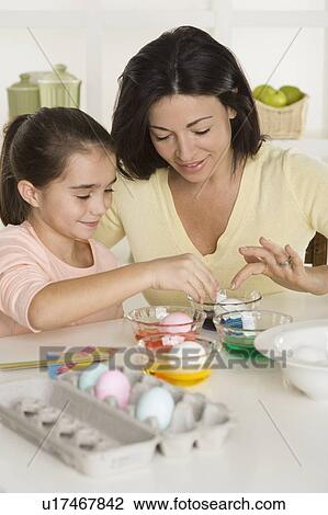 Mother and daughter coloring Easter eggs View Large Photo Image Stock Image - Mother and daughter coloring Easter eggs. Fotosearch