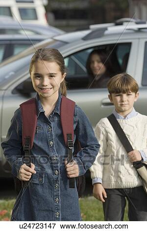Mother dropping children off at school View Large Photo Image Stock Photo - Mother dropping children off at school. Fotosearch