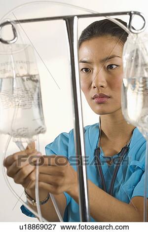 Stock Photo - Nurse at work. Fotosearch