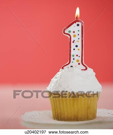 Stock Photo - One candle on a cupcake. Fotosearch