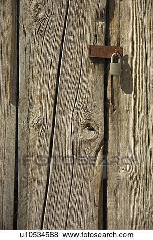 Padlock on a barn door View Large Photo Image Stock Photo - Padlock on a barn door. Fotosearch