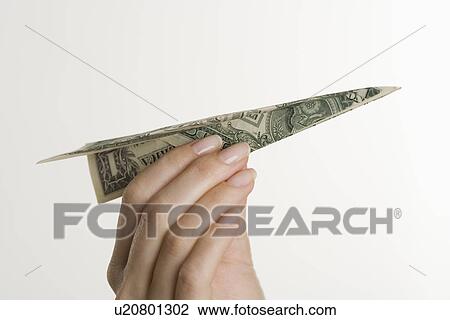Paper airplane made of money View Large Photo Image Stock Image - Paper airplane made of money. Fotosearch