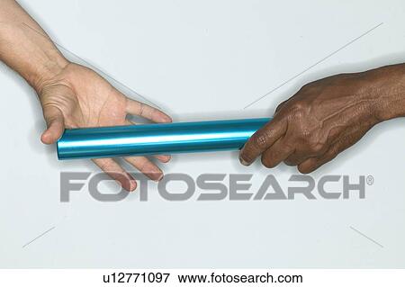 Stock Photo - Passing baton from one hand to another. Fotosearch