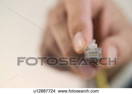 Person connecting a cable View Large Photo Image Picture - Person connecting a cable. Fotosearch
