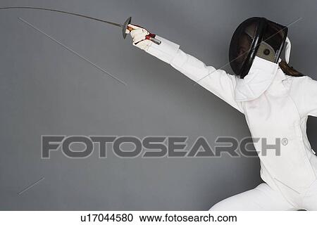 Stock Image - Person engaged in fencing. Fotosearch