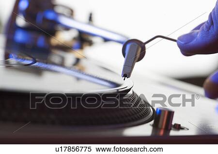 Person setting needle on a record View Large Photo Image Stock Photography - Person setting needle on a record. Fotosearch