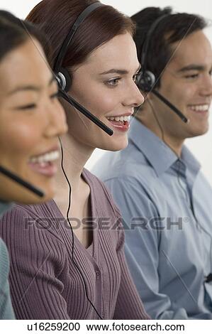 Phone operators using headsets View Large Photo Image Stock Image - Phone operators using headsets. Fotosearch