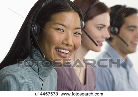 Stock Photo - Phone operators using headsets. Fotosearch