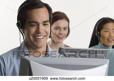 Stock Photo - Phone operators using headsets. Fotosearch