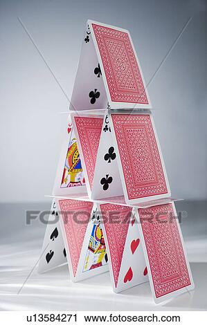 Playing cards stacked into a pyramid View Large Photo Image Stock Image - Playing cards stacked into a pyramid. Fotosearch