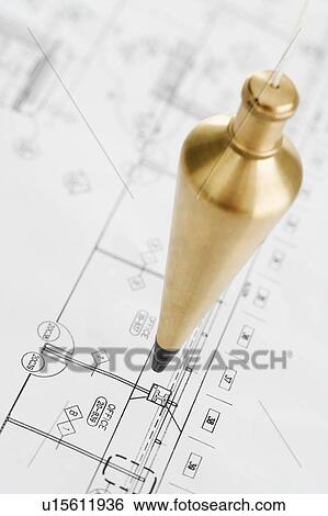 Plumb bob above blueprints View Large Photo Image Stock Photograph - Plumb bob above blueprints. Fotosearch