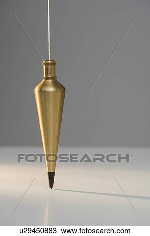 Plumb bob suspended from plumb line View Large Photo Image Stock Image - Plumb bob suspended from plumb line. Fotosearch