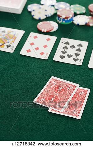 Stock Image - Poker hand and chips. Fotosearch