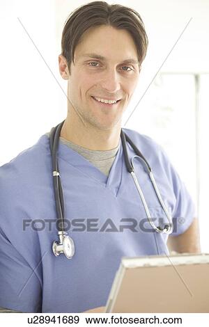 Portrait of a male doctor View Large Photo Image Stock Photo - Portrait of a male doctor. Fotosearch