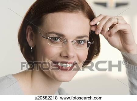 Portrait of a smiling woman View Large Photo Image Stock Photo - Portrait of a smiling woman. Fotosearch