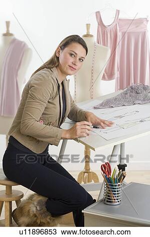 Portrait of a young fashion designer View Large Photo Image Stock Image - Portrait of a young fashion designer. Fotosearch