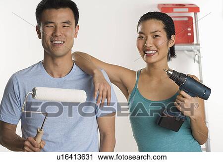 Portrait of couple doing home repairs View Large Photo Image Stock Image - Portrait of couple doing home repairs. Fotosearch