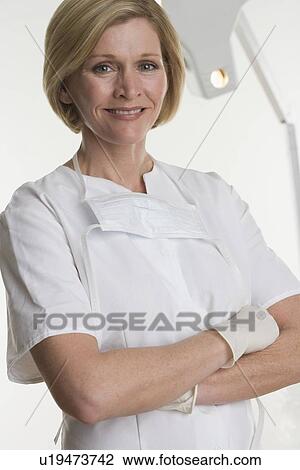 Stock Image - Portrait of dental hygienist. Fotosearch