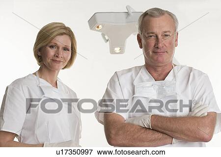 Stock Photo - Portrait of dentist with dental hygienist. Fotosearch