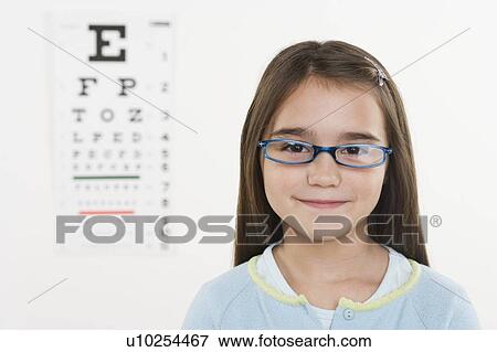 Stock Photo - Portrait of girl wearing glasses. Fotosearch