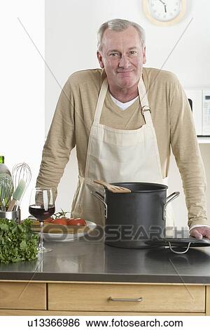 Portrait of man cooking View Large Photo Image Stock Photograph - Portrait of man cooking. Fotosearch