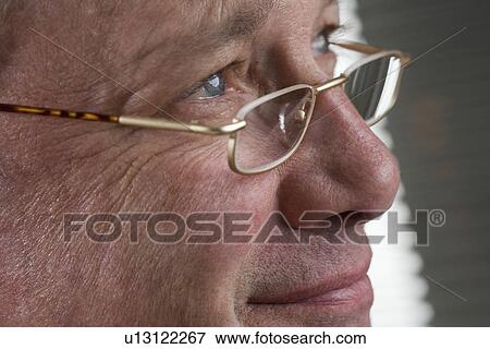 Portrait of man with glasses View Large Photo Image Stock Photo - Portrait of man with glasses. Fotosearch