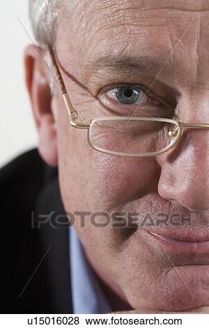 Stock Photo - Portrait of man with glasses. Fotosearch