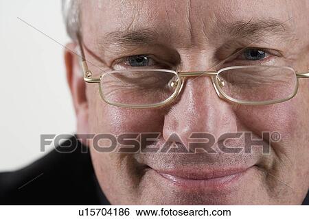 Portrait of man with glasses View Large Photo Image Stock Photograph - Portrait of man with glasses. Fotosearch