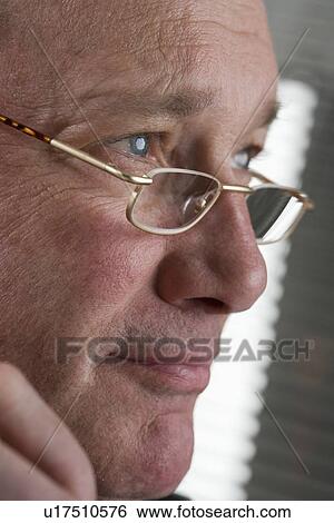 Portrait of man with glasses View Large Photo Image Stock Photograph - Portrait of man with glasses. Fotosearch