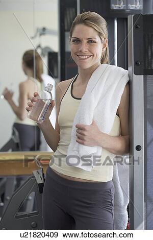 Stock Photo - Portrait of woman after workout. Fotosearch